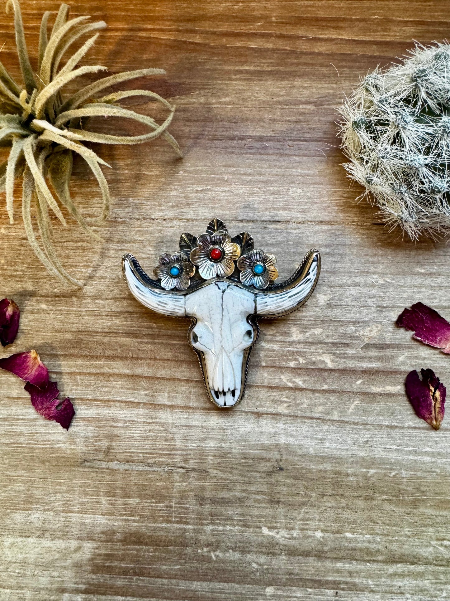 Big Antler longhorn with turquoise pendant with color flowers